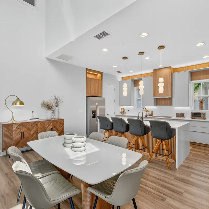 Modern gray and wood kitchen with dining area