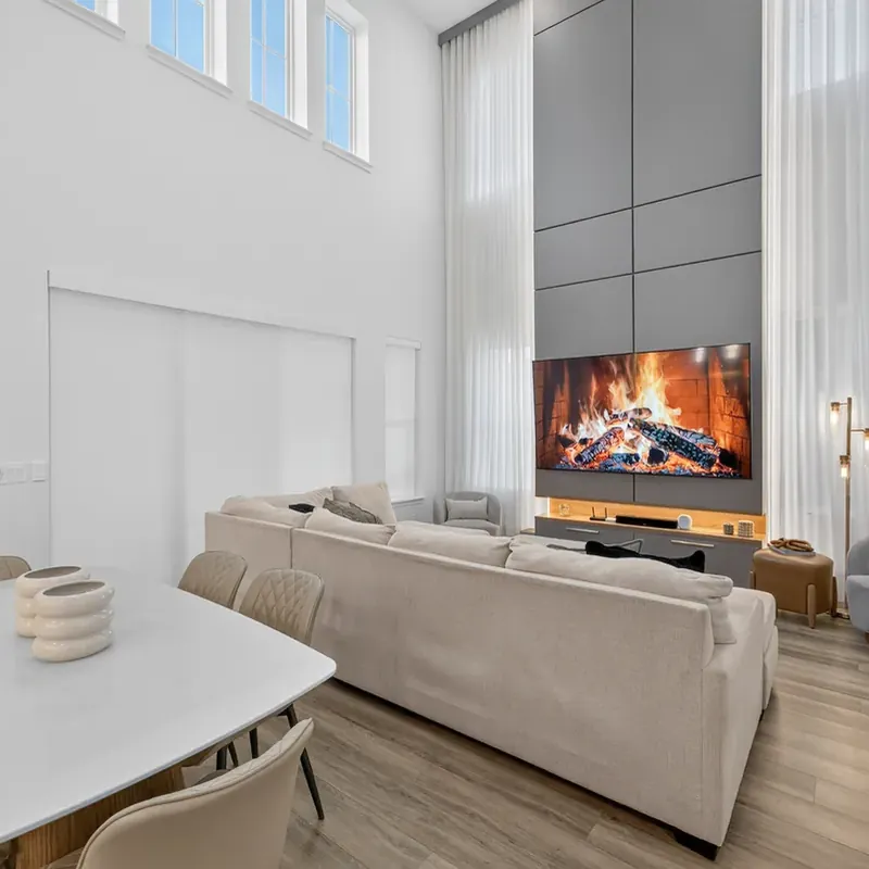 High-ceiling living room with fireplace